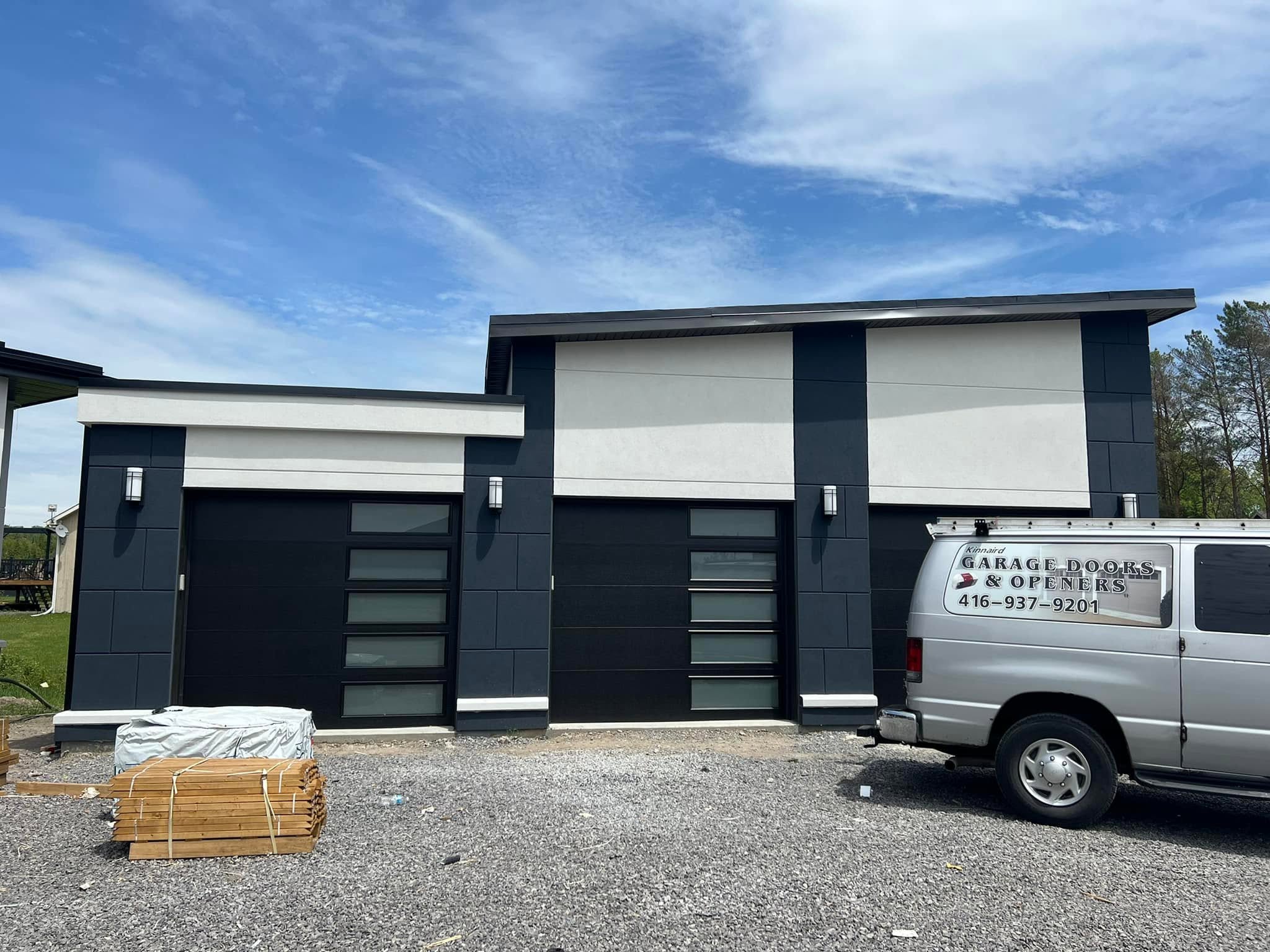 Three modern black garage doors