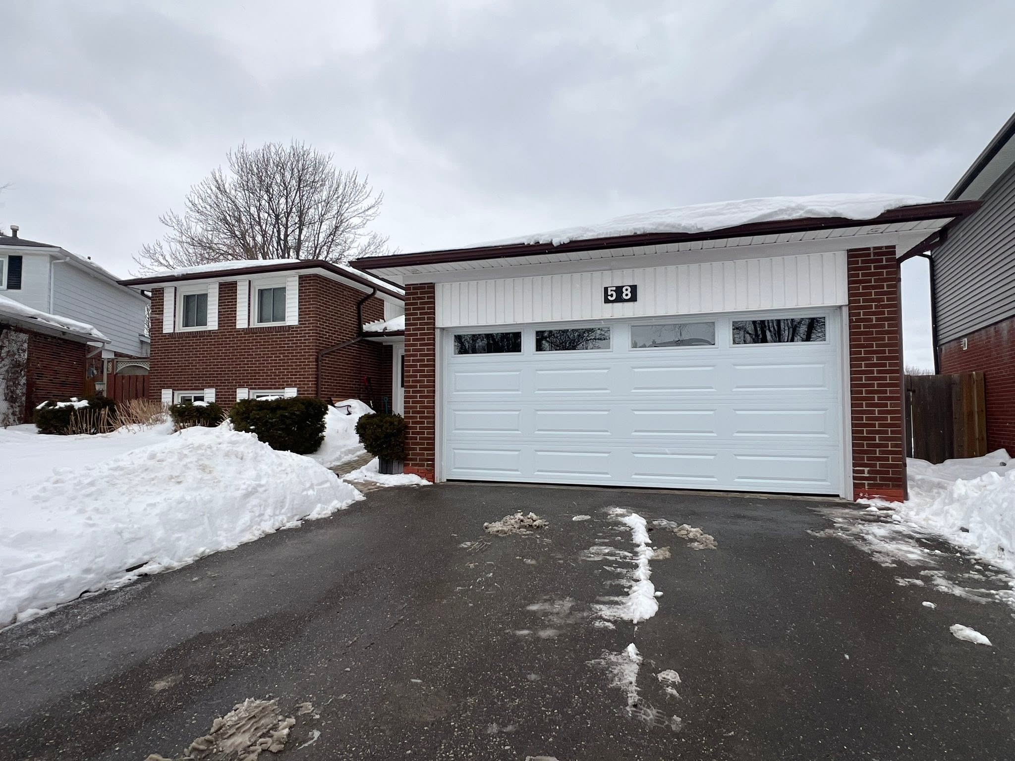 White garage door installed in winter